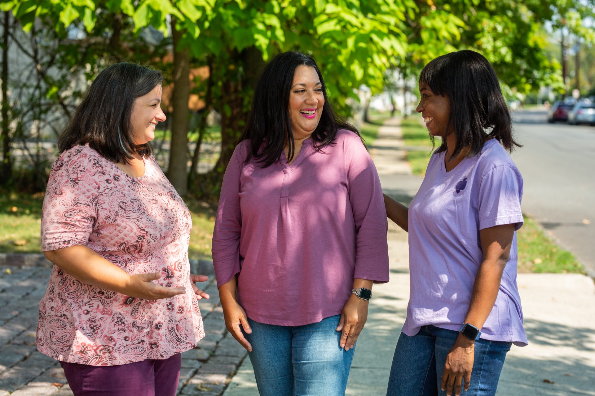 three adult women having a conversation